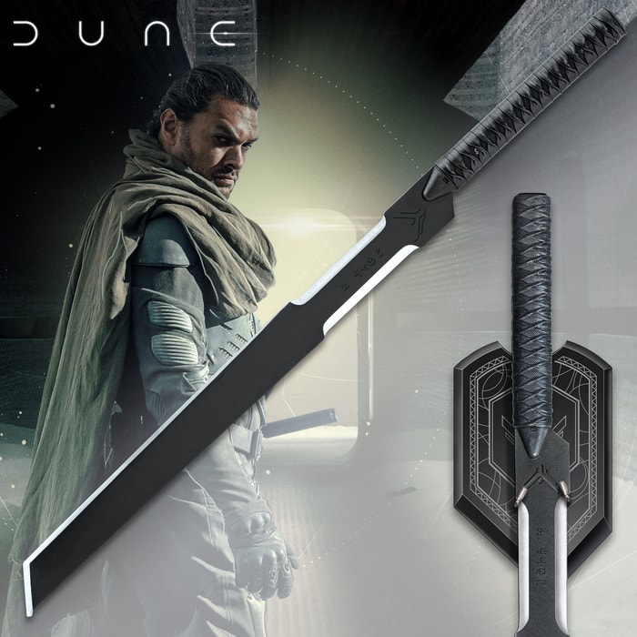 The Long Blade of Duncan Idaho, an exact film prop replica, showcased alongside the character from Dune and mounted on its elegant wall plaque.