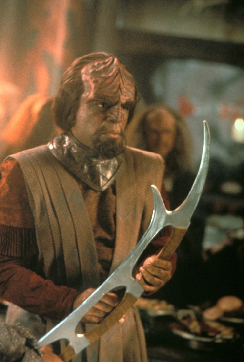 Worf, a Starfleet officer, is a fierce Klingon warrior.